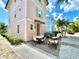 Home featuring outdoor seating and a 'Margaritaville' hot tub at 8001 Sand Bar Dr, Kissimmee, FL 34747