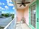 Balcony view of neighborhood and parking area with a ceiling fan at 8001 Sand Bar Dr, Kissimmee, FL 34747