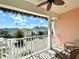 Balcony view of colorful neighborhood homes with a ceiling fan at 8001 Sand Bar Dr, Kissimmee, FL 34747