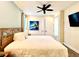 This bedroom features light yellow walls, and an ensuite for maximum comfort at 8001 Sand Bar Dr, Kissimmee, FL 34747