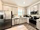 Modern kitchen featuring stainless steel appliances, ample counter space, and sleek cabinetry at 8001 Sand Bar Dr, Kissimmee, FL 34747
