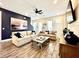 Cozy living room featuring stylish decor, comfortable seating, and a large wall painting at 8001 Sand Bar Dr, Kissimmee, FL 34747