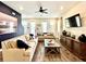 Inviting living room with modern decor, plush sofas, and a large entertainment center at 8001 Sand Bar Dr, Kissimmee, FL 34747