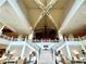 Impressive lobby featuring a grand staircase, soaring ceilings, and stylish seating areas at 8001 Sand Bar Dr, Kissimmee, FL 34747
