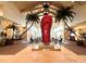 Impressive lobby featuring tropical landscaping, large red flip flop statue, and ample seating at 8001 Sand Bar Dr, Kissimmee, FL 34747