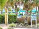 Community pool offers cabana rentals, an outdoor shower, and plenty of lush tropical landscaping at 8001 Sand Bar Dr, Kissimmee, FL 34747