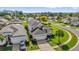 An aerial shot of a well-maintained single-Gathering home surrounded by lush greenery and neighboring houses at 8160 Sun Palm Dr, Kissimmee, FL 34747