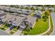 An aerial shot of a well-maintained home surrounded by lush greenery and screened-in pools at 8160 Sun Palm Dr, Kissimmee, FL 34747