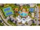 Aerial view of a community clubhouse featuring a pool, tennis courts, and a basketball court at 8160 Sun Palm Dr, Kissimmee, FL 34747
