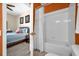 Combined bedroom and bathroom showcases toilet, tub, and tiled shower at 8160 Sun Palm Dr, Kissimmee, FL 34747