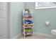 Bathroom with a stack of decorative towels and a window with natural light at 8160 Sun Palm Dr, Kissimmee, FL 34747