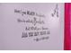 Close-up of whimsical wall decor featuring an Alice in Wonderland quote and decorative initial at 8160 Sun Palm Dr, Kissimmee, FL 34747