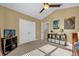 Bedroom showcases storage shelving, white closet doors, and artwork on walls at 8160 Sun Palm Dr, Kissimmee, FL 34747