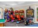 An impressive game room features an arcade, a ping pong table, and a pool table for endless entertainment at 8160 Sun Palm Dr, Kissimmee, FL 34747