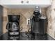 Close up of the kitchen counter with coffee makers and tile backsplash at 8160 Sun Palm Dr, Kissimmee, FL 34747