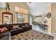 Open-concept living area with vaulted ceilings and sliding glass doors to a patio at 8160 Sun Palm Dr, Kissimmee, FL 34747