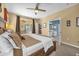 Main bedroom with an en suite bathroom and sliding glass door to outside patio at 8160 Sun Palm Dr, Kissimmee, FL 34747