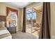 Main bedroom with a sliding glass door that provides access to outside patio and pool at 8160 Sun Palm Dr, Kissimmee, FL 34747