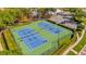 Aerial view of well-maintained community tennis courts with lush green landscaping at 8160 Sun Palm Dr, Kissimmee, FL 34747