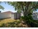 Backyard shed surrounded by well-maintained fence at 8856 Hastings Beach Blvd, Orlando, FL 32829