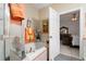 Bathroom featuring a tub, shower, and adjacent vanity in view at 8856 Hastings Beach Blvd, Orlando, FL 32829