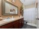 Functional bathroom with a vanity, toilet, and shower with curtain at 8856 Hastings Beach Blvd, Orlando, FL 32829