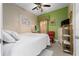 Cozy bedroom with neutral tones, floral accents, and functional storage solutions at 8856 Hastings Beach Blvd, Orlando, FL 32829
