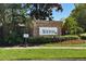 Newport brick community welcome sign with tropical landscaping on a sunny day at 8856 Hastings Beach Blvd, Orlando, FL 32829