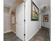 Hallway view showcases an open door into the bathroom and tile flooring at 8856 Hastings Beach Blvd, Orlando, FL 32829
