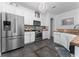 Bright kitchen with stainless steel appliances, white cabinetry, and stylish backsplash at 8856 Hastings Beach Blvd, Orlando, FL 32829
