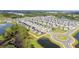 Aerial view of a Primary planned community with winding streets and ponds at 917 Jackson Ave, Davenport, FL 33837