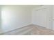 Bright bedroom features neutral carpet and a double-door closet for ample storage at 917 Jackson Ave, Davenport, FL 33837
