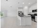 Open concept kitchen and living room with modern appliances and finishes at 917 Jackson Ave, Davenport, FL 33837