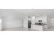 Open-concept kitchen with stainless steel appliances and a central island at 917 Jackson Ave, Davenport, FL 33837