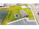Aerial view of a community featuring a playground, clubhouse, and pond, with parking at 921 Jackson Ave, Davenport, FL 33837