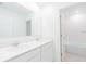 This bathroom features double sinks, and an accessible bathtub at 921 Jackson Ave, Davenport, FL 33837