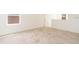 A carpeted bonus room with a double hung window and a neutral palette at 921 Jackson Ave, Davenport, FL 33837