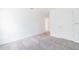 This bedroom features neutral carpet, white walls, and ample natural light at 921 Jackson Ave, Davenport, FL 33837