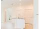 A minimalistic kitchen island with stainless steel faucet and sink in a white walled space at 921 Jackson Ave, Davenport, FL 33837