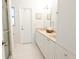Elegant bathroom with double vanity, granite countertops, and ample storage space at 935 Amy Ridge Ct, Kissimmee, FL 34747
