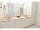 Elegant bathroom with double vanity, granite countertops, and ample storage space at 935 Amy Ridge Ct, Kissimmee, FL 34747