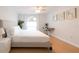 Bright bedroom features a large bed, modern desk, and tasteful decor to complete the relaxing atmosphere at 935 Amy Ridge Ct, Kissimmee, FL 34747