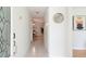 Bright hallway with tile flooring, white walls, and modern decor at 935 Amy Ridge Ct, Kissimmee, FL 34747