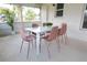 Cozy patio with a dining table and seating, perfect for outdoor meals and relaxation at 935 Amy Ridge Ct, Kissimmee, FL 34747