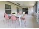 Relaxing screened-in patio with dining and seating areas, ideal for enjoying the outdoors at 935 Amy Ridge Ct, Kissimmee, FL 34747