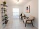 Cozy sitting room featuring stylish chairs, shelving, and a window, creating a relaxing ambiance at 935 Amy Ridge Ct, Kissimmee, FL 34747