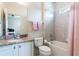 Bathroom featuring shower/tub combo, granite vanity, and neutral colors at 9963 Hartford Maroon Rd, Orlando, FL 32827