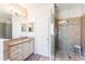 Bathroom featuring granite vanity top, glass shower, and neutral color scheme at 9963 Hartford Maroon Rd, Orlando, FL 32827