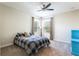 Bedroom featuring a ceiling fan, a large window, and carpet floors at 9963 Hartford Maroon Rd, Orlando, FL 32827