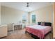 Bedroom with simple decor and comfortable furnishings, including an accent beanbag chair at 9963 Hartford Maroon Rd, Orlando, FL 32827